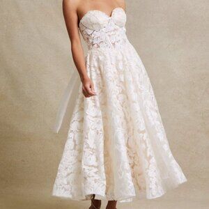 Off white t length wedding dress. Strapless lace up back short bridal gown